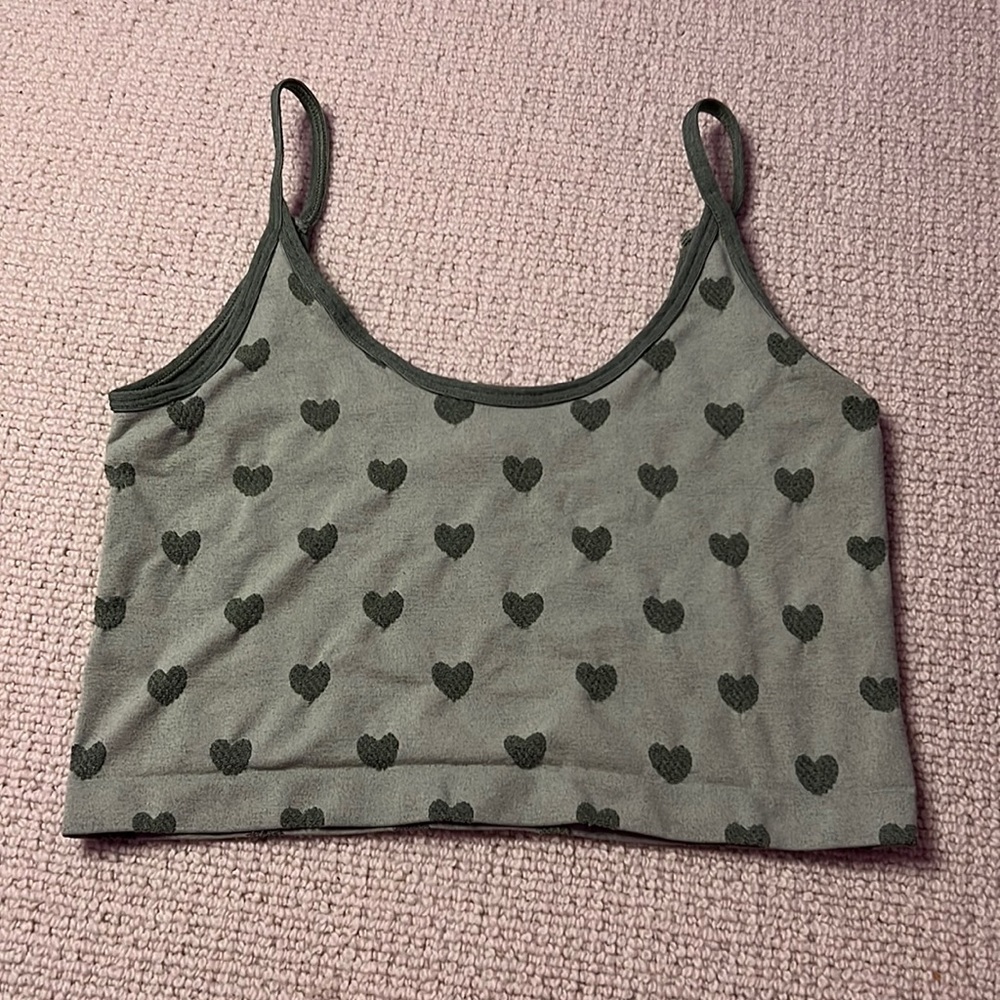 Green heart out from under crop top